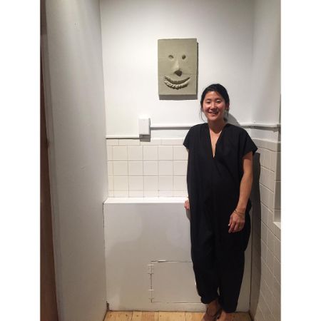 Lisa Bai took a picture at her art exhibition at Fortnight Institute.